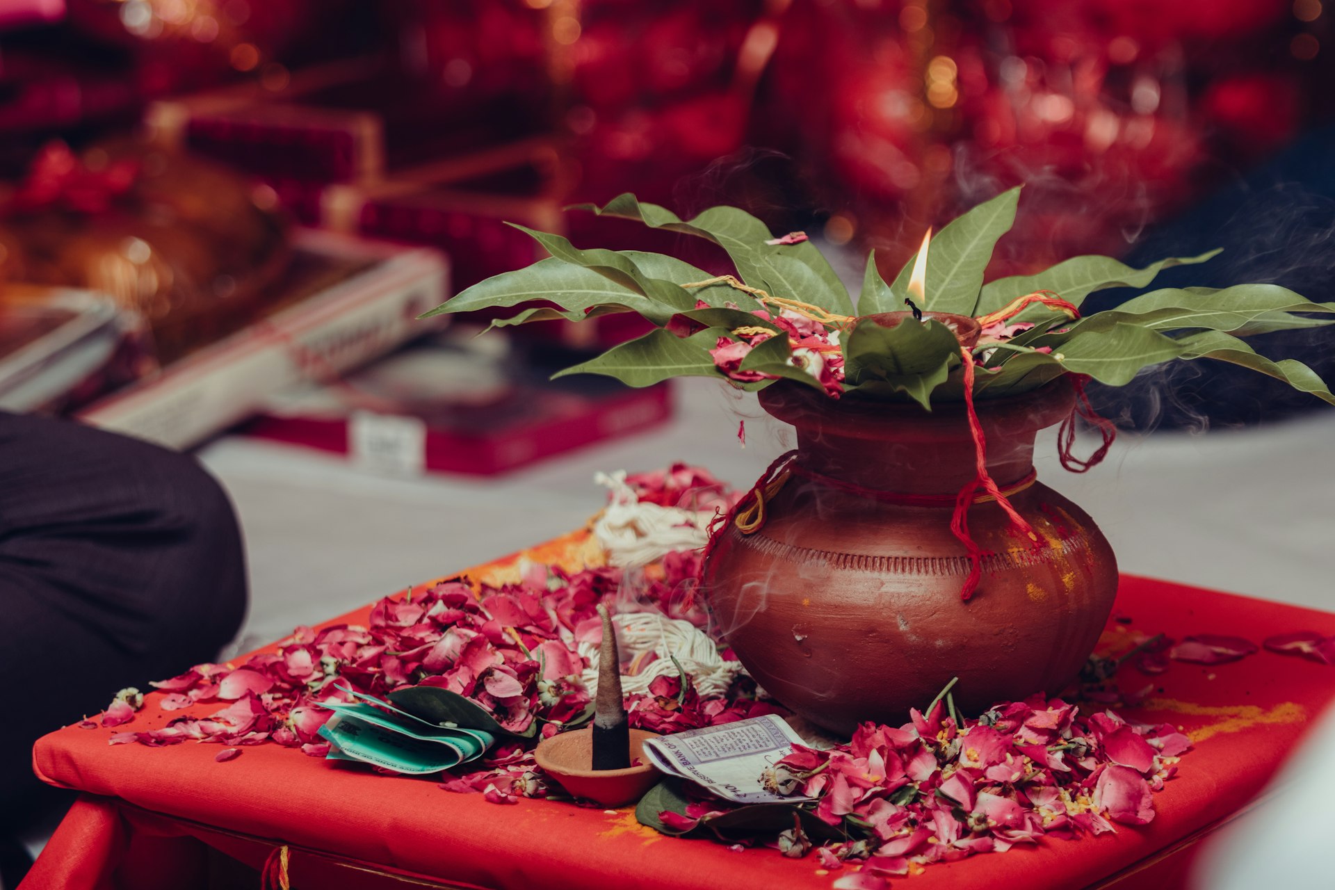 a vase filled with flowers sitting on top of a table